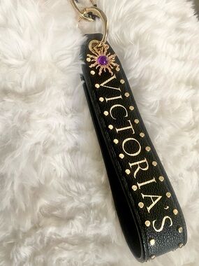 Victoria's Secret Black and Gold Logo Wristlet with Purple Charm